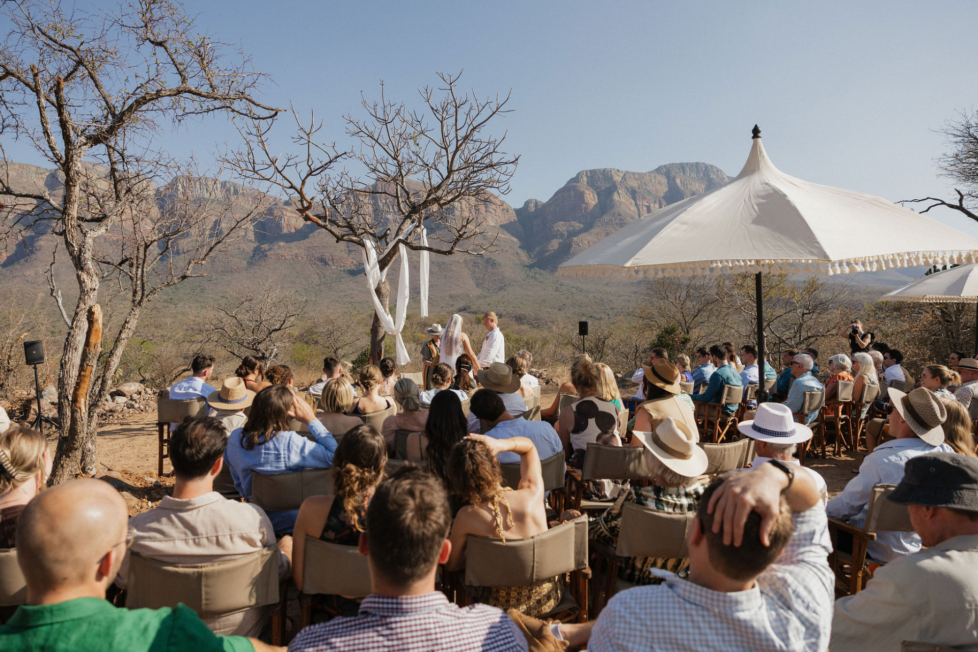Ceremony on the lawn with Drakensberg escarpment views