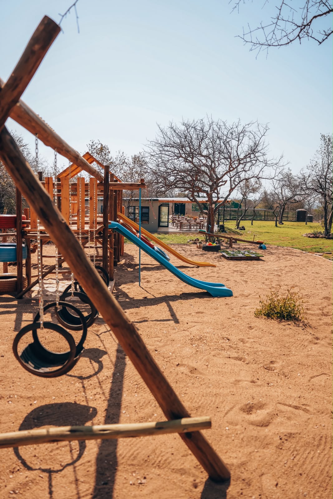 The playground on the lawn in front of the cafe building