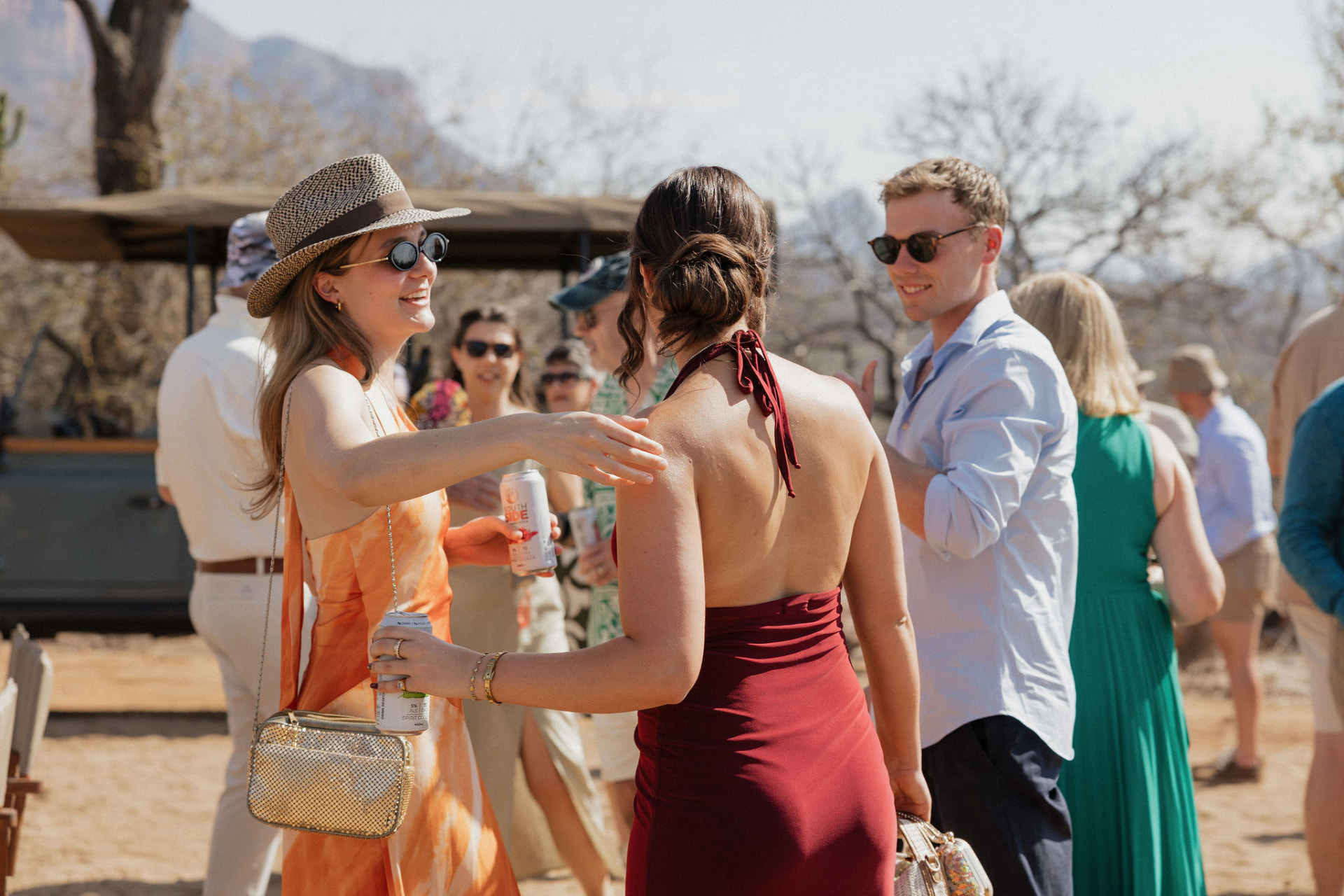 Guests mingling in the veld during the celebration